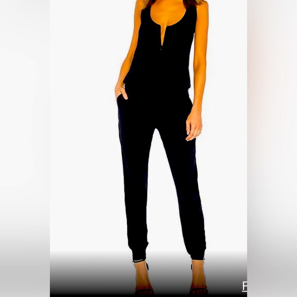 Black sleeveless jumpsuit.